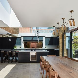open plan kitchen and dining room with sliding doors and rooflights