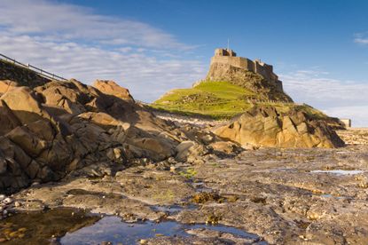 Holy Island, Lindisfarne, with Lindisfarne Castle towering above the island.