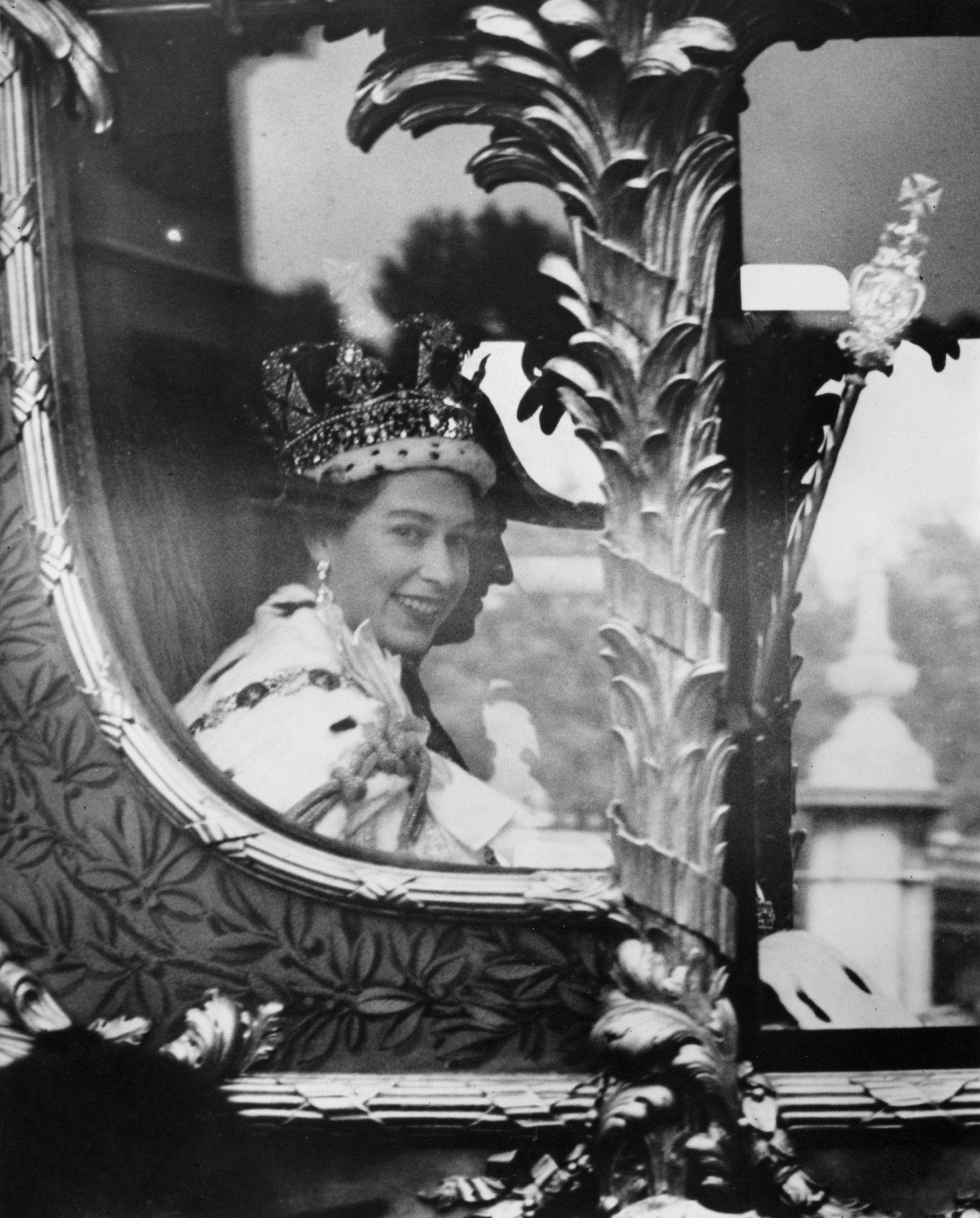 Queen Elizabeth riding in a carriage on her coronation day