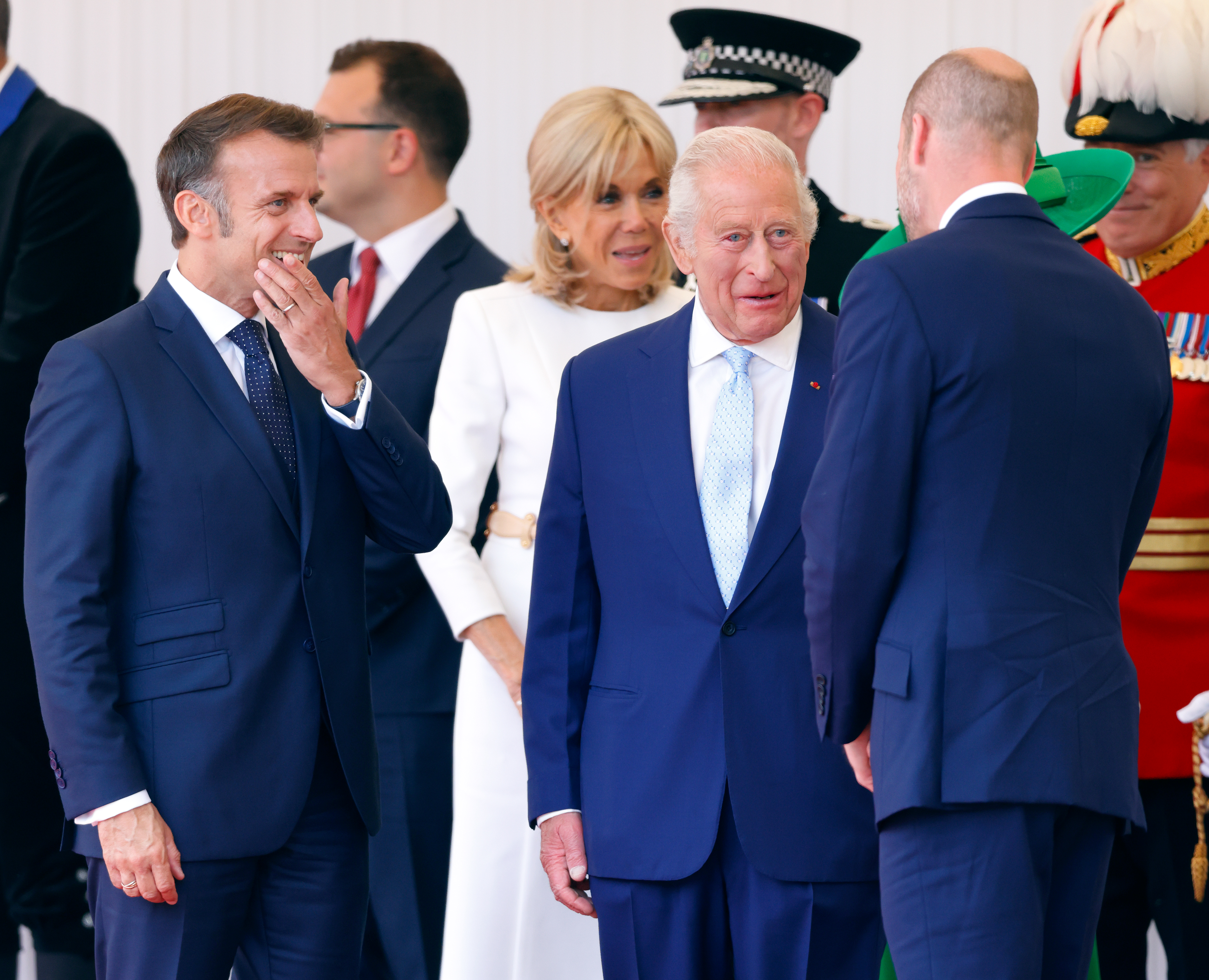 King Charles, Emmanuel Macron and Prince William wearing blue suits