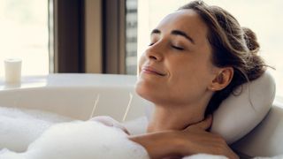 Woman relaxing in bath