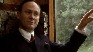 Patrick Malahide as Inspector Alleyn on a train in The Inspector Alleyn Mysteries