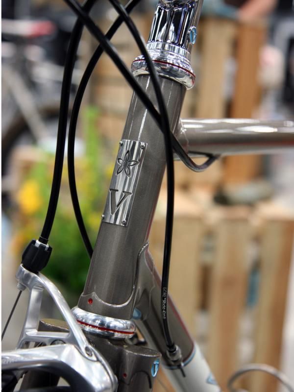 Vanilla started with a standard Chris King headset then milled a subtle groove around the periphery, accented it with a bit of red, and polished it to a high luster.