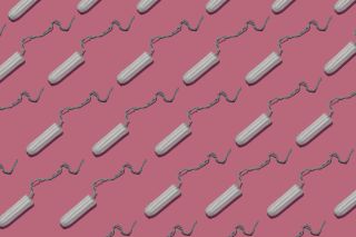 Tampon period products on pink background