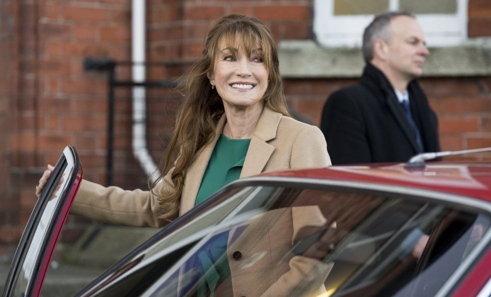 Harry Wild season 3: Jane Seymour as Harry, posing next to a car and smiling