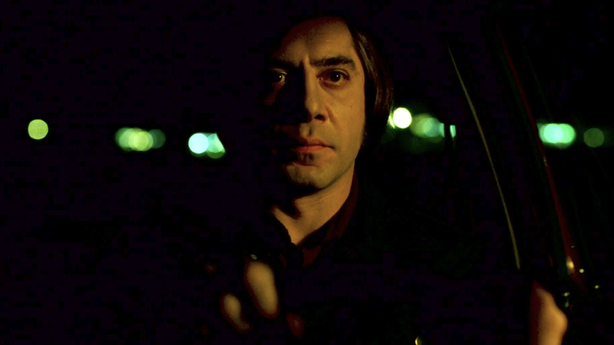 Javier Bardem as Anton Chigurh driving at night in No Country For Old Men