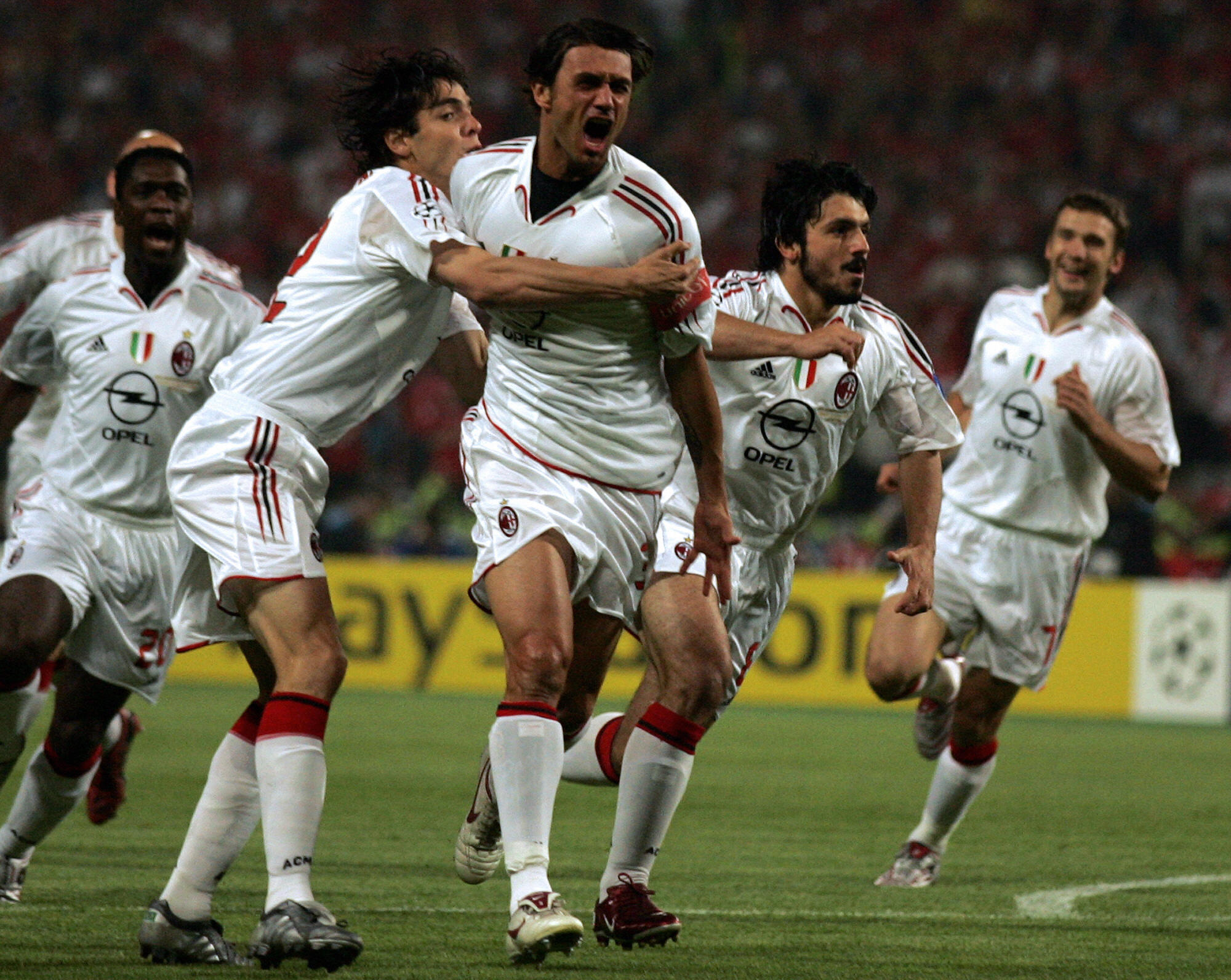Paolo Maldini celebrates with his AC Milan team-mates after scoring the opening goal against Liverpool in the 2005 Champions League final.
