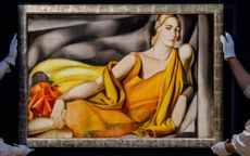 Sotheby's workers carry the Tamara de Lempicka 1929 painting "Femme a la robe jaune"