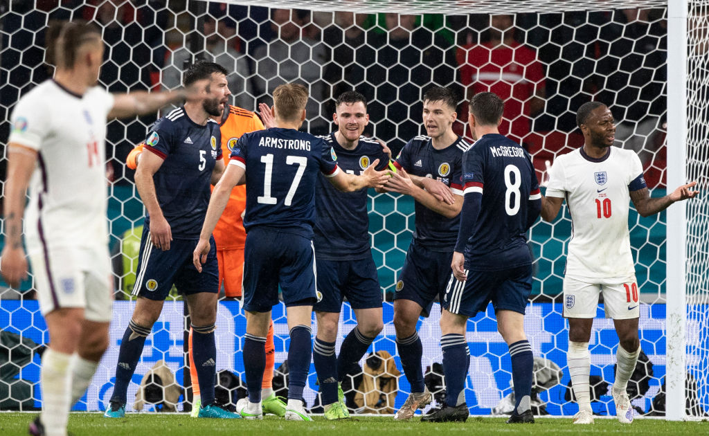 Andrew Robertson and Kieran Tierney celebrate a late clearance against England at Euro 2020