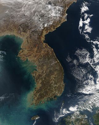 In this image taken by the MODIS instrument on NASA's Aqua satellite, the Korean peninsula's differences disappear.