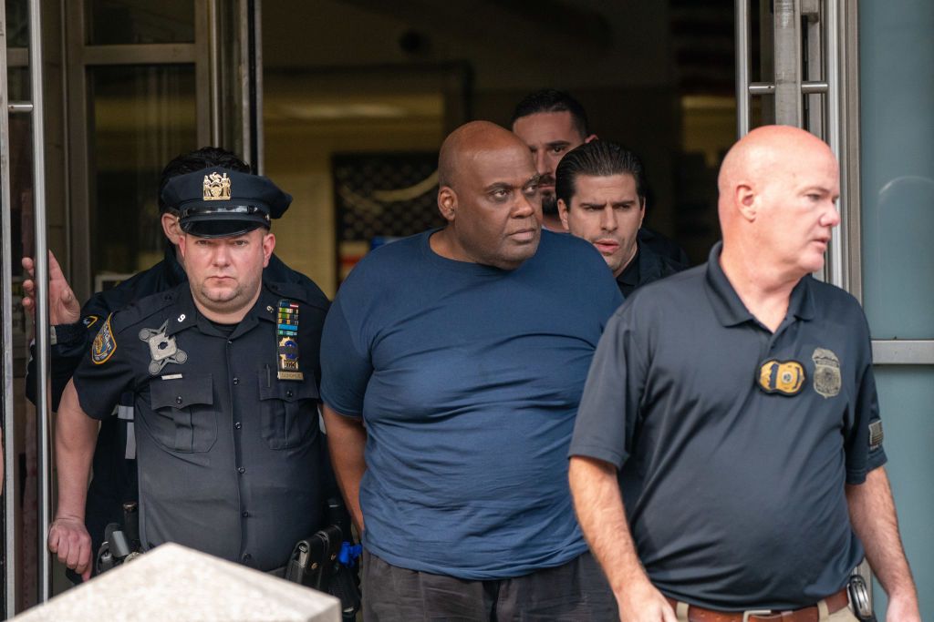 Subway shooting suspect Frank James surrounded by police.