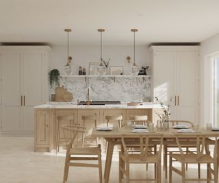 pale coloured fitted kitchen with wooden dining table and chairs