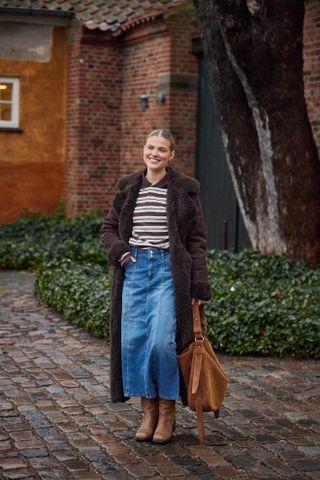 Photo of Scandi woman in winter street style during Copenhagen Fashion Week Fall-Winter 2025.