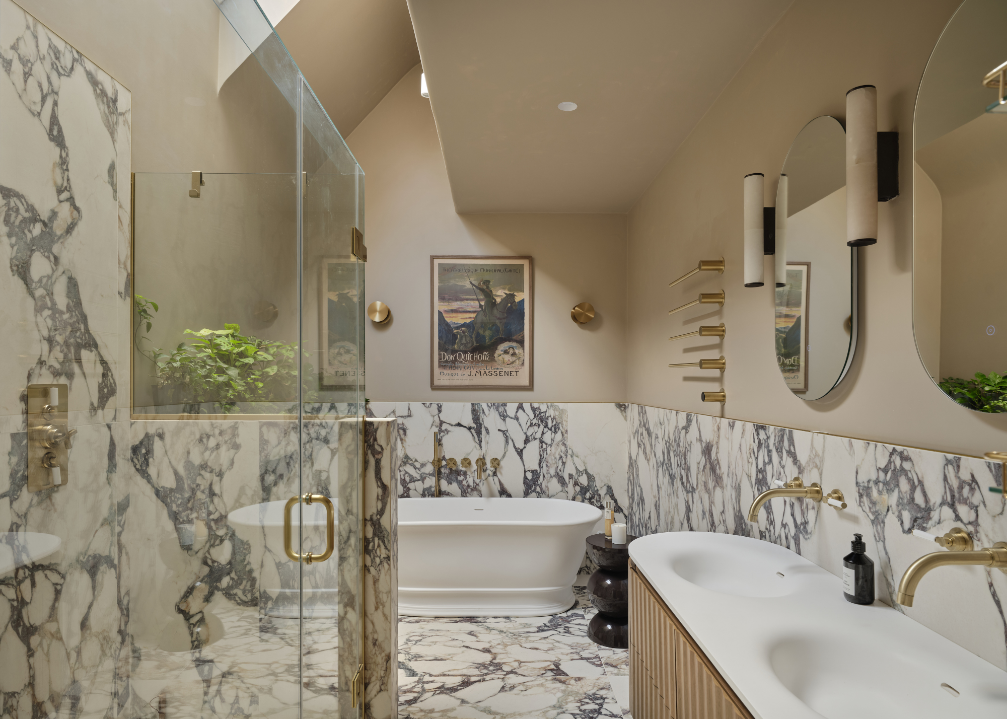 A modern take on a classic marble bathroom with bath and shower and double vanity