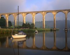 The Calstock Viaduct across the River Tamar in Cornwall on a misty late Summer morning.