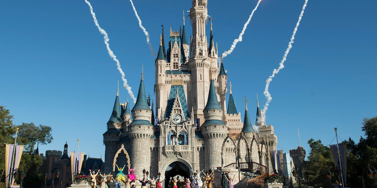 Fireworks go off behind Cinderella&#039;s castle at Disney World.