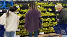 Shoppers and bananas in a supermarket