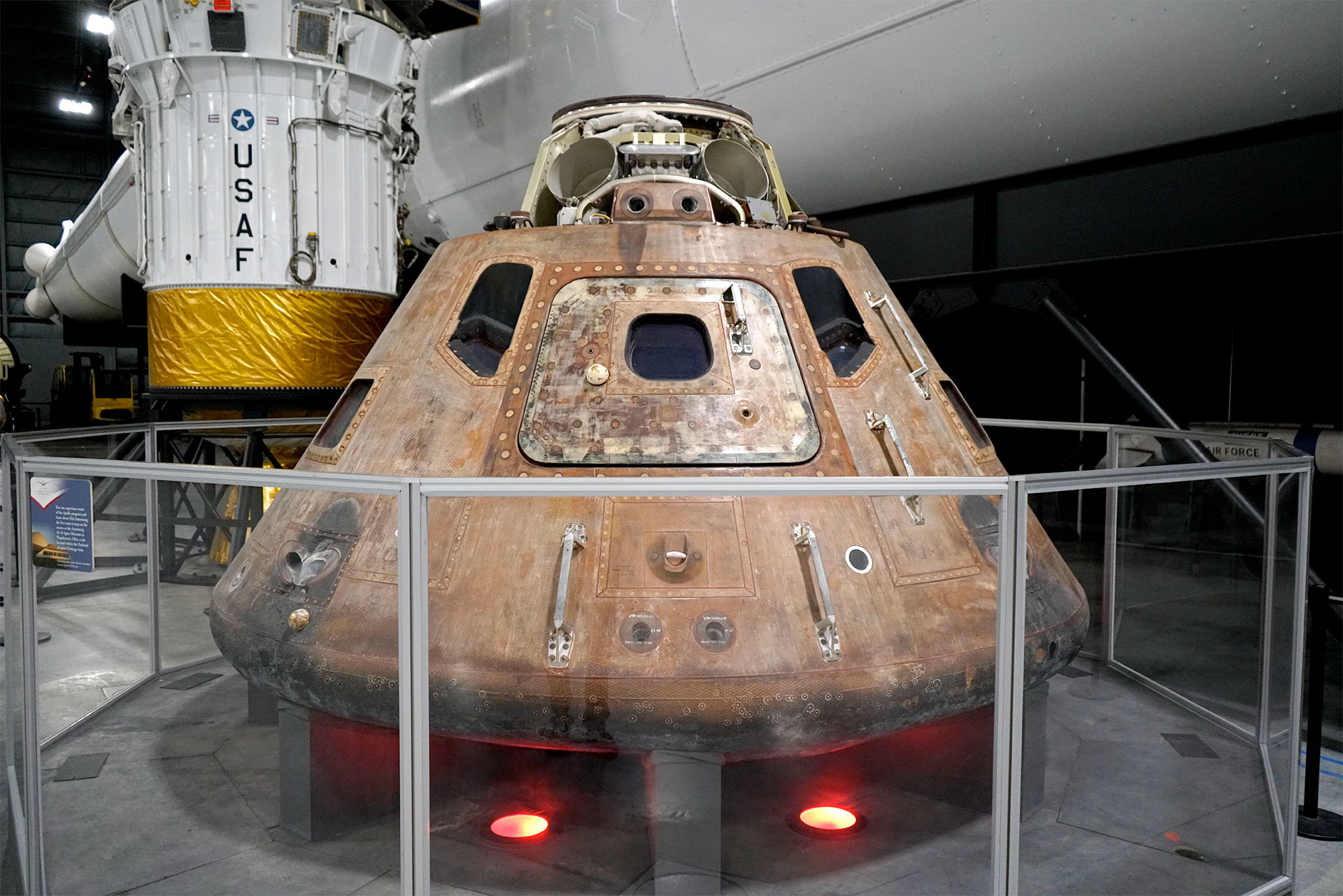 a space capsule sits on display in a space museum