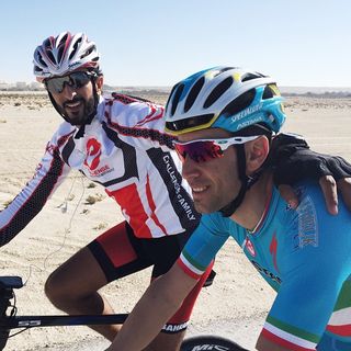 Prince Nasser bin Hamad Al Khalifa of Bahrain rides with Vincenzo Nibali