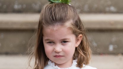 Princess Charlotte of Cambridge attends the wedding of Princess Eugenie of York and Jack Brooksbank at St George's Chapel in Windsor Castle on October 12, 2018 in Windsor, England