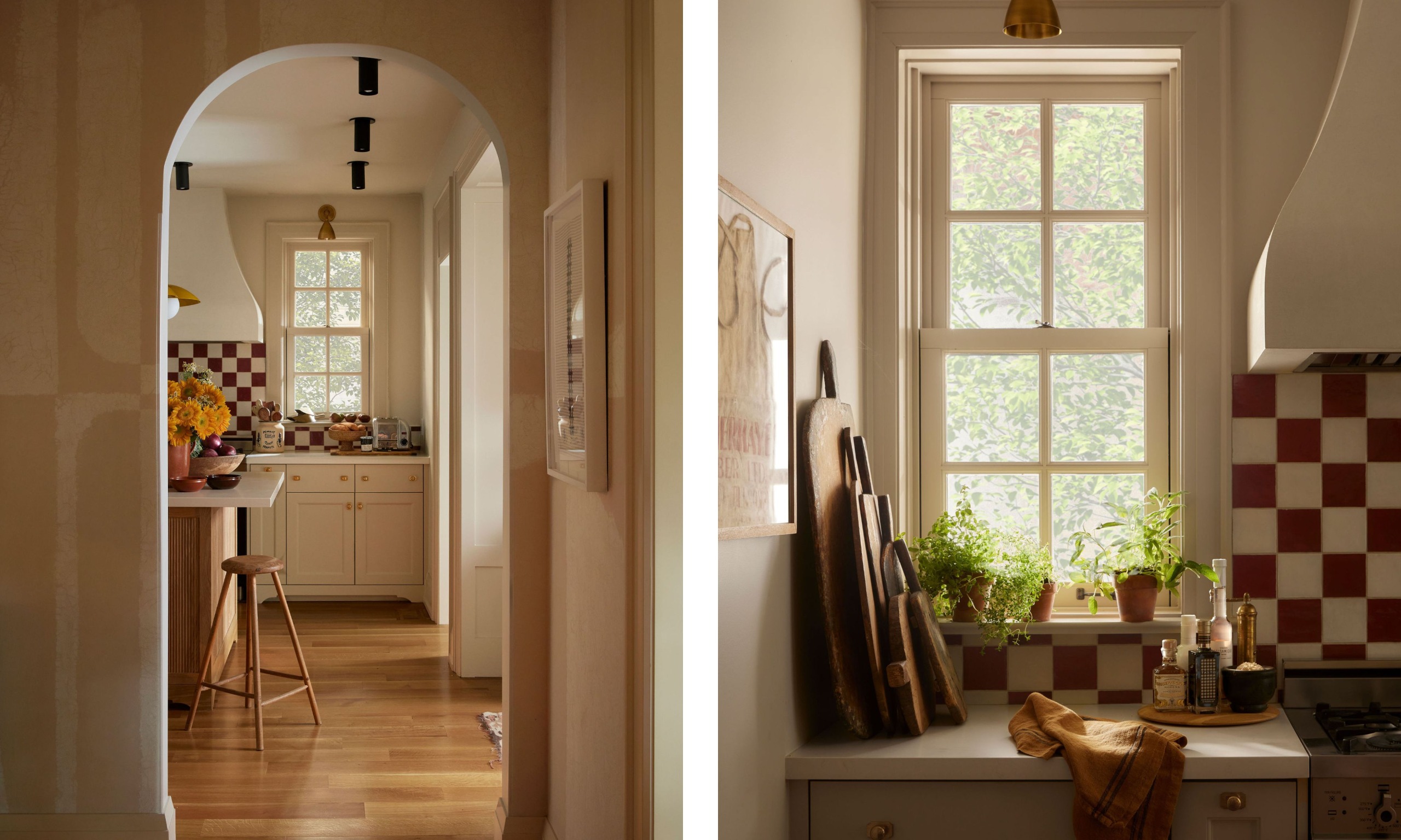 Two images of a cozy cottage kitchen with an arched doorway, neutral cabinets, an island, and burgundy and cream checkerboard backsplash tiles.
