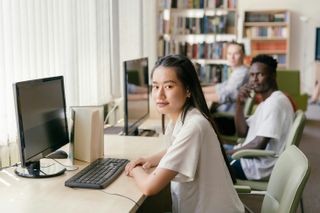 Students sitting at computers at school