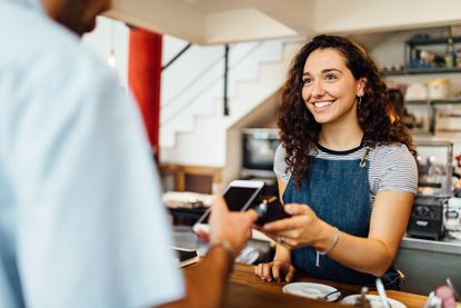 Customer paying in coffee shop