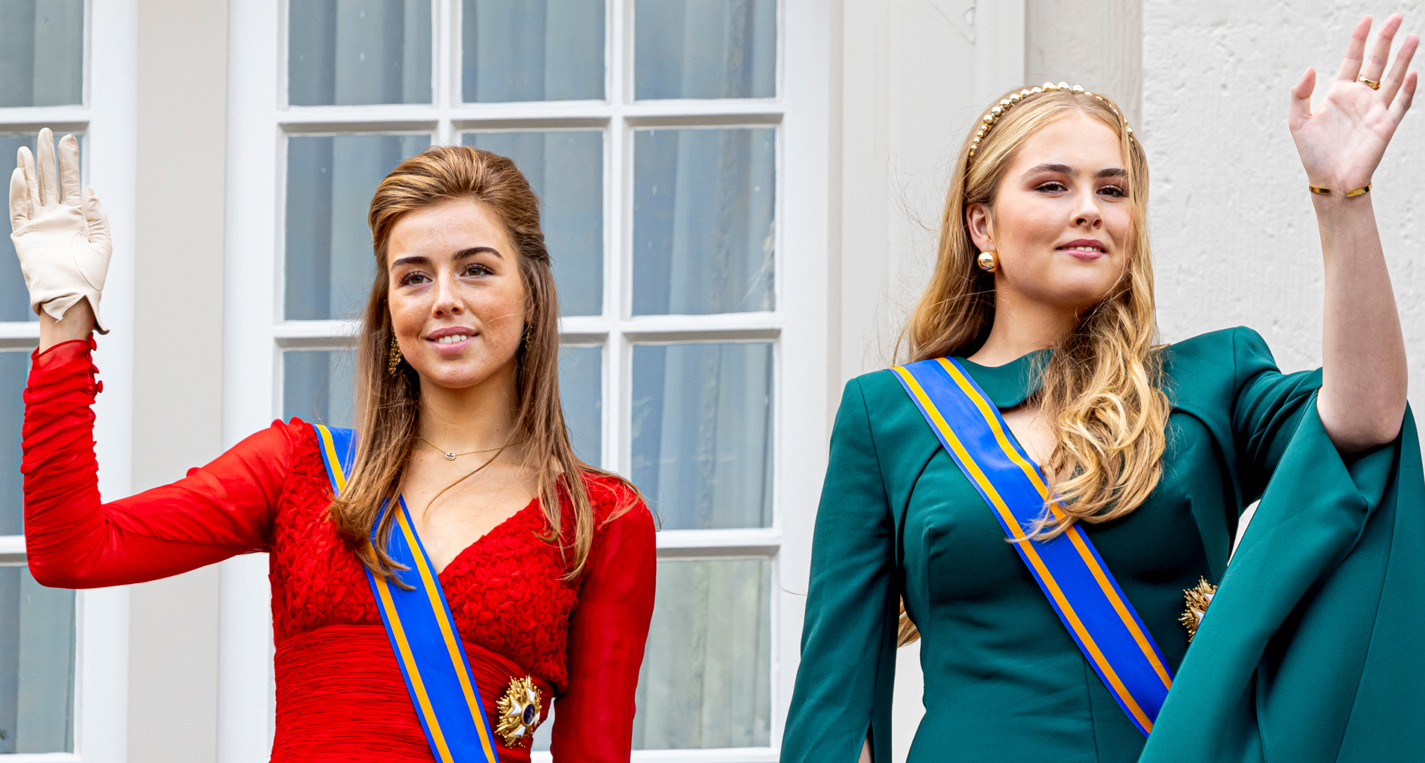 Princess Alexia and Princess Amalia waving in evening gowns