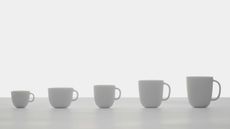 Coffee cups lined up, from small to large, part of exhibition 'Italian Passion: The Art of Espresso'