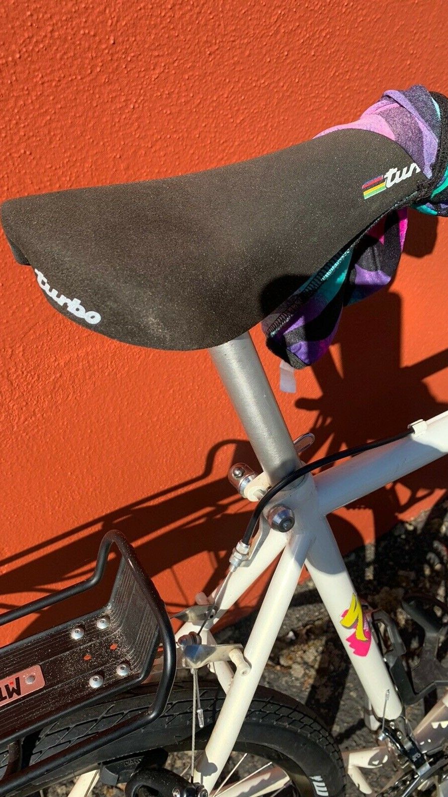 Saddle is original and features rainbow stripe detailing