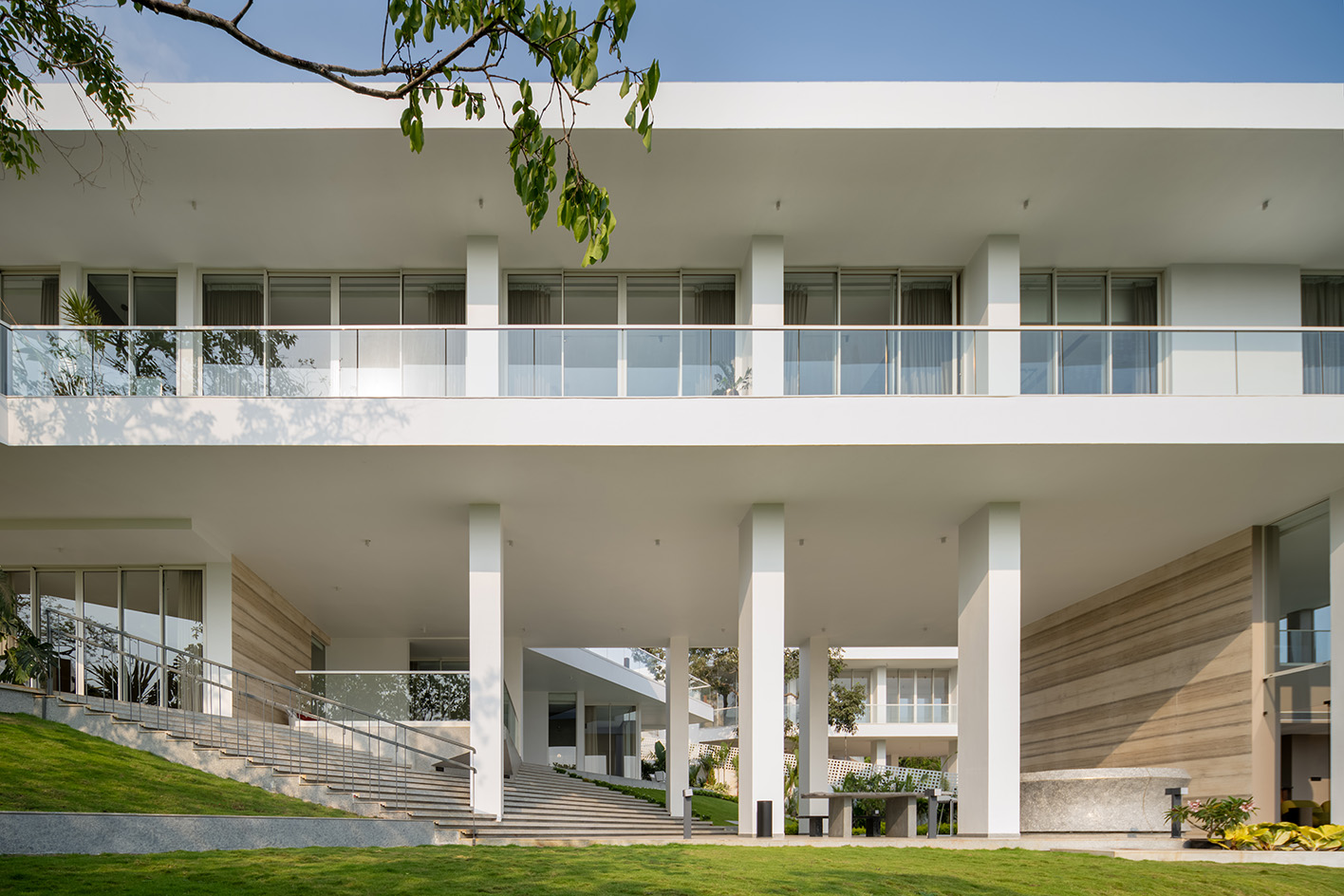 a white Goa villa in the leafy indian forest