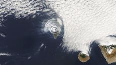 A satellite image of the concentric cloud rings above La Palma created by its erupting volcano.