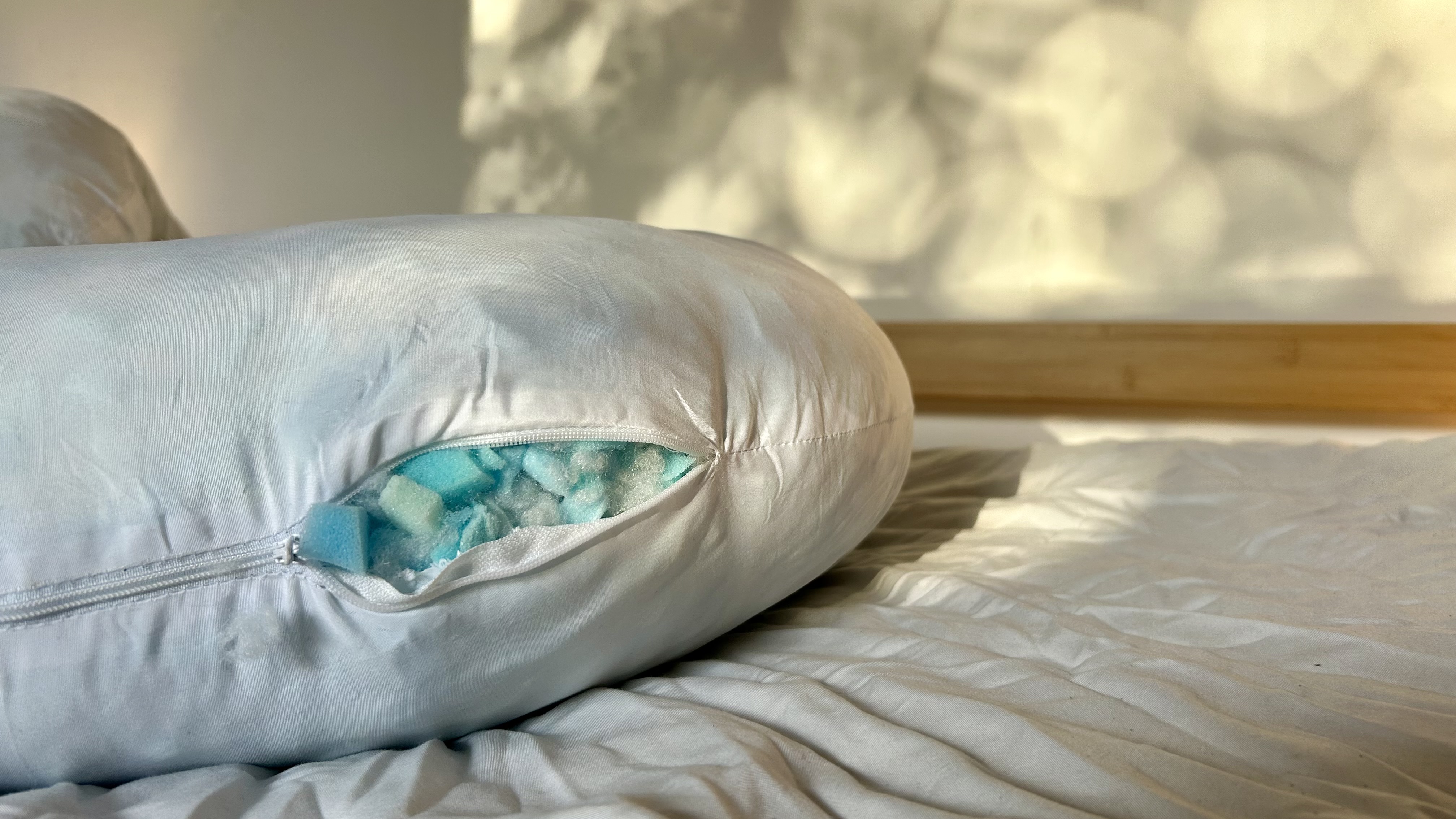 The Yana 360&amp;deg; Body Pillow zipped open to show blue gel memory foam filling