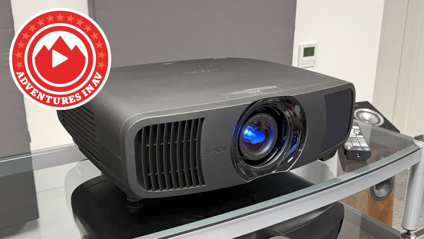 An Epson projector on a glass and metal unit