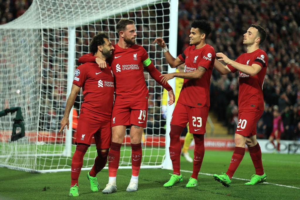 Mohamed Salah of Liverpool celebrates scoring their second goal from the penalty spot with Jordan Henderson, Luis Diaz and Diogo Jota during the UEFA Champions League Group A match between Liverpool FC and Rangers FC at Anfield on October 4, 2022 in Liverpool, United Kingdom.