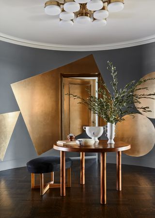 A dining room with paint tricks in gold foil