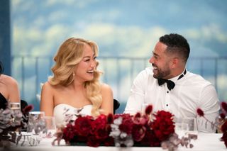 Janelle and Adam laughing together on their wedding day