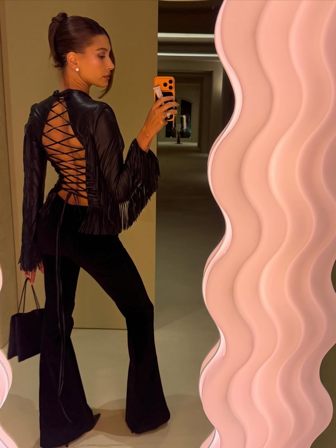 Hailey Bieber celebrated her November 2025 birthday in a vintage leather Versace jacket