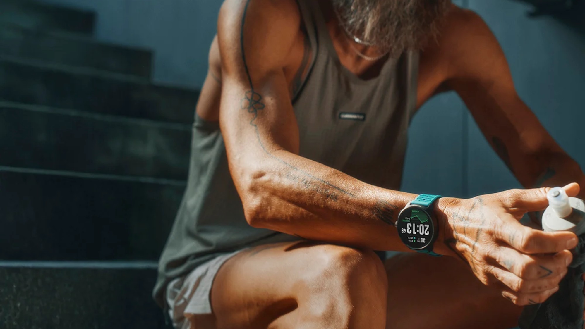 Man in sports outfit with fitness watch
