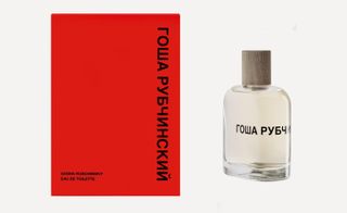 A perfume bottle and a red card