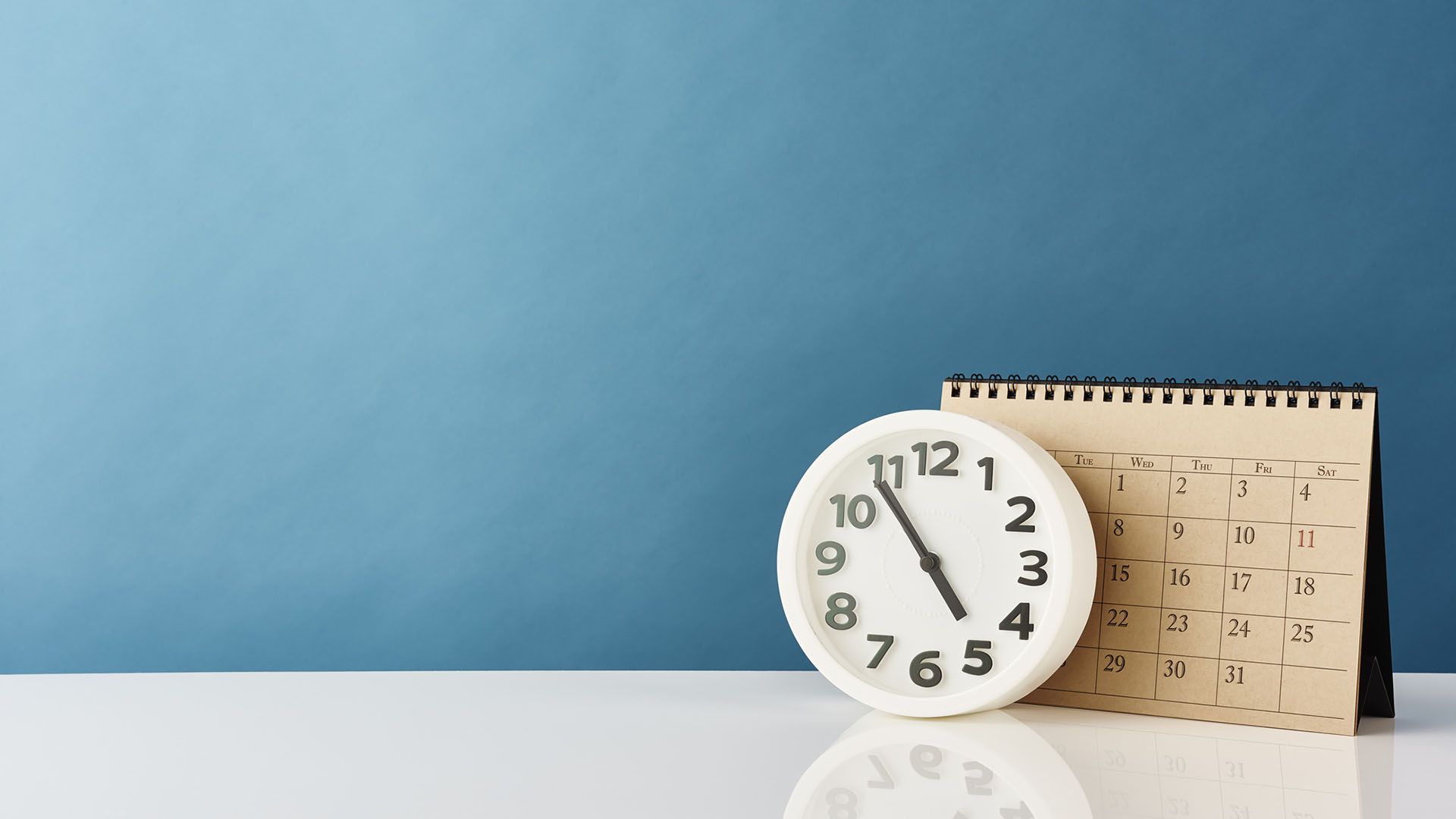 clock and a calendar on a blue background