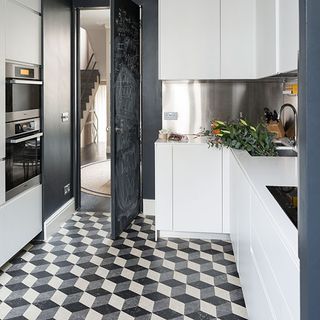 kitchen with geometric flooring and black door