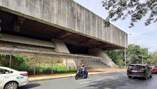 Philippine Brutalism, the facade of Folk Arts Theater in Manila with biker going past