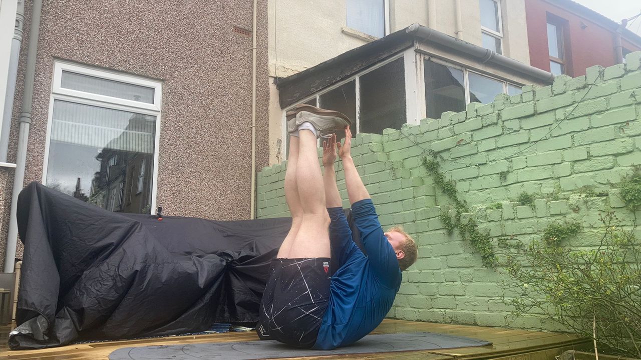 Fit&amp;Well fitness writer Harry Bullmore demonstrating a toe touch