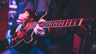 Guitar playing stock photo