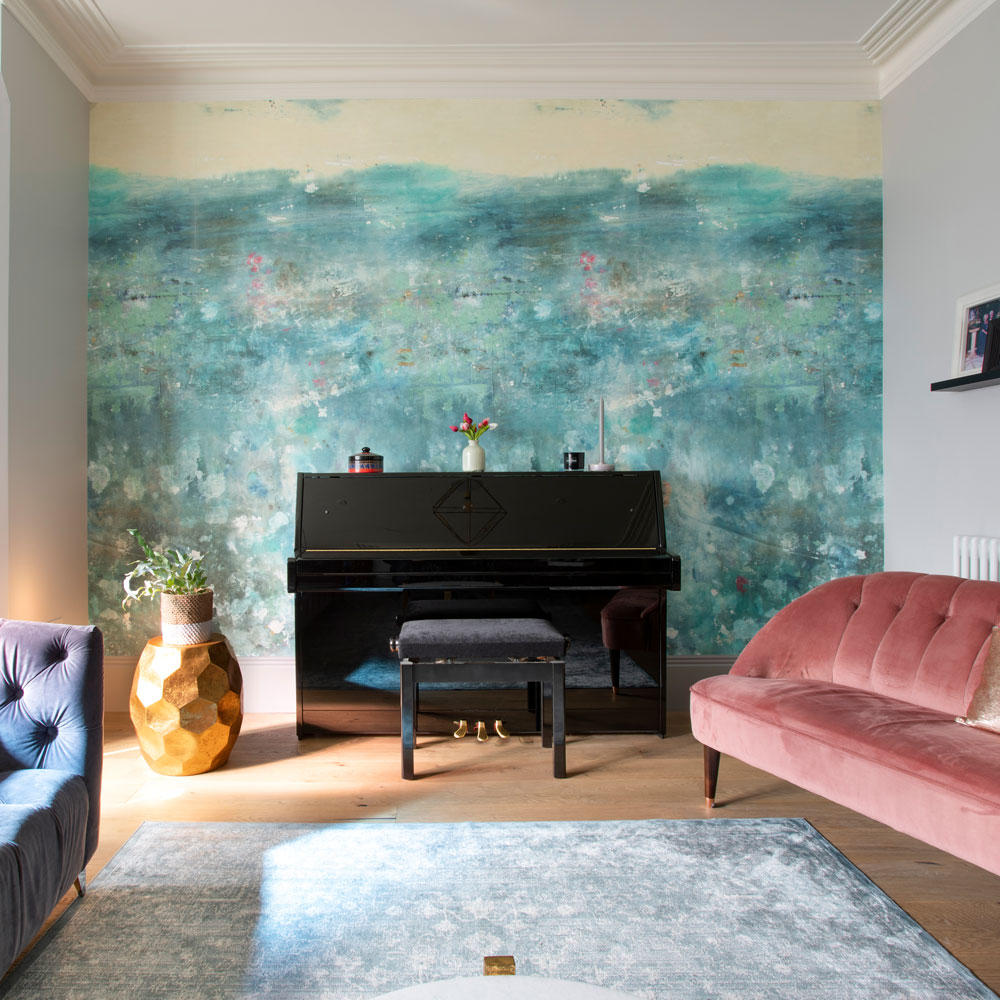 Blue living room with a seascape feature wall mural