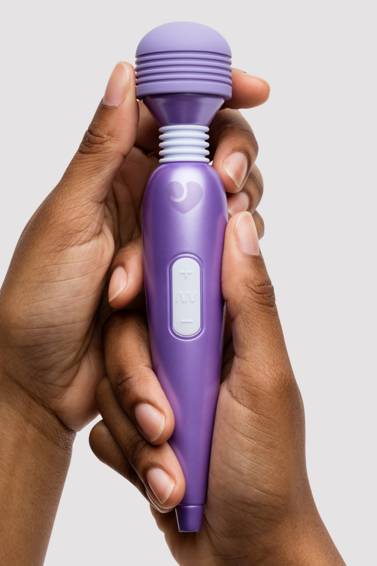 hands holding a purple wand vibrator