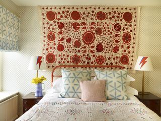 bedroom with vintage Suzani wall hanging