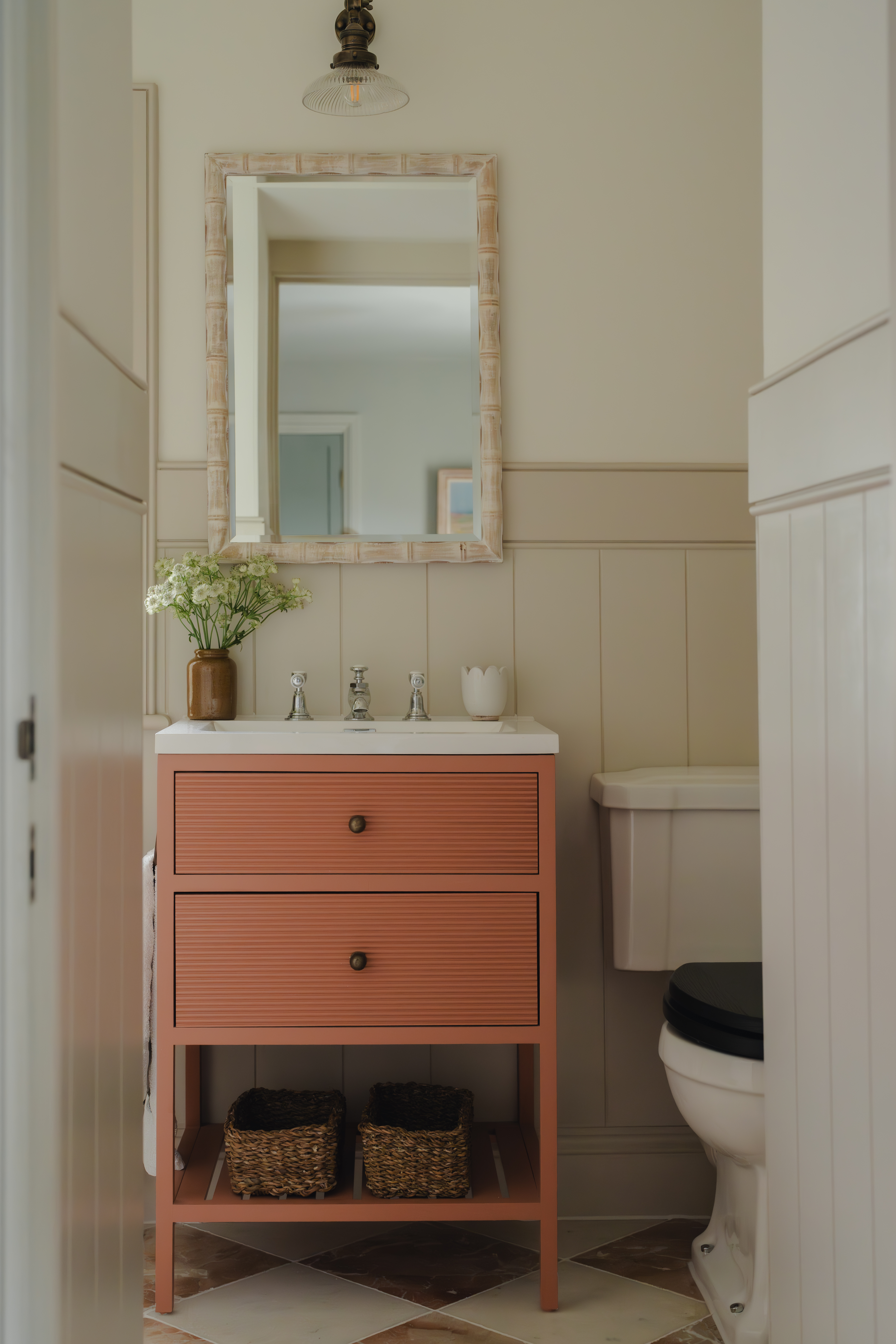 beige bathroom with terracotta vanity unit by House Nine