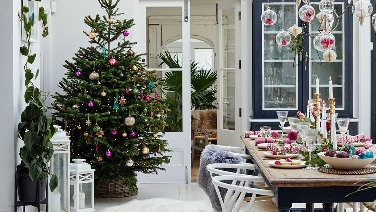 christmas tree with decoration and white wall